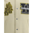 Cream Polyamide BomberThe Lion Wool Varsity Jacket by Off-White blends urban sophistication with bold detailing. Crafted from a premium wool blend, it features a structured silhouette with snap-button closure. The embroidered patches at the front and the