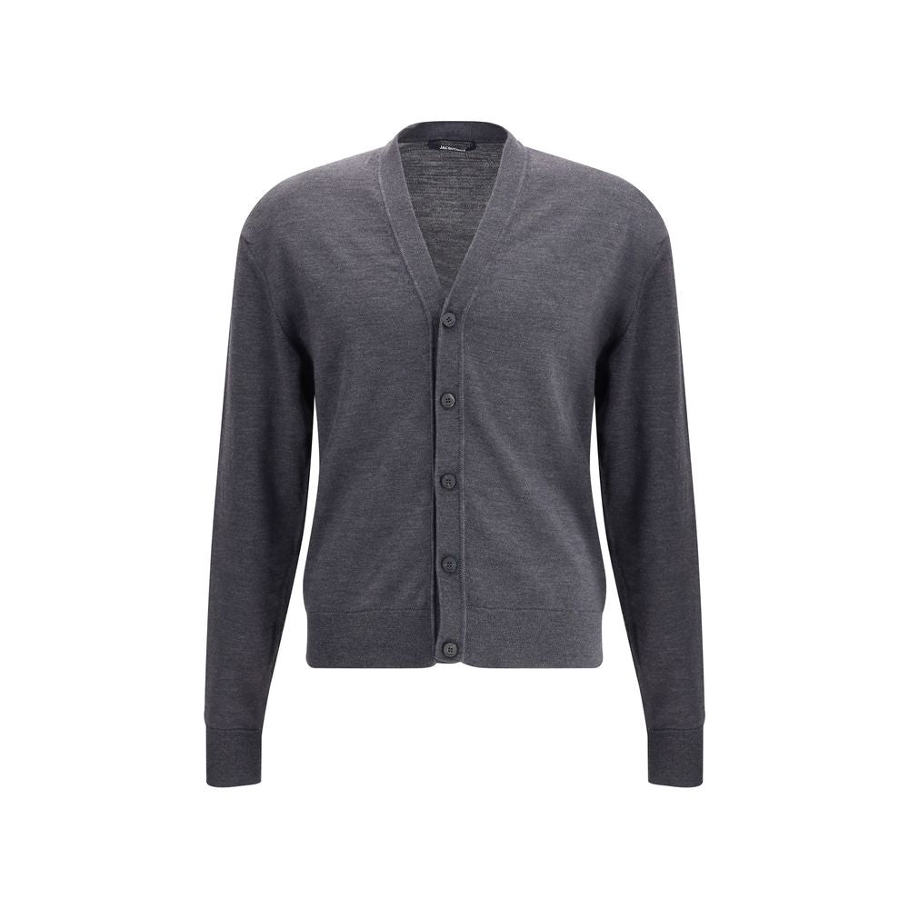 Gray Merino Wool CardiganThe merino Wool Cardigan by Jacquemus blends elegance with comfort, embodying a timeless appeal. Its V-neckline and front button closure echo classic tailoring, while ribbed hem and cuffs provide structure and refinement. At the b