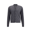 Gray Merino Wool CardiganThe merino Wool Cardigan by Jacquemus blends elegance with comfort, embodying a timeless appeal. Its V-neckline and front button closure echo classic tailoring, while ribbed hem and cuffs provide structure and refinement. At the b