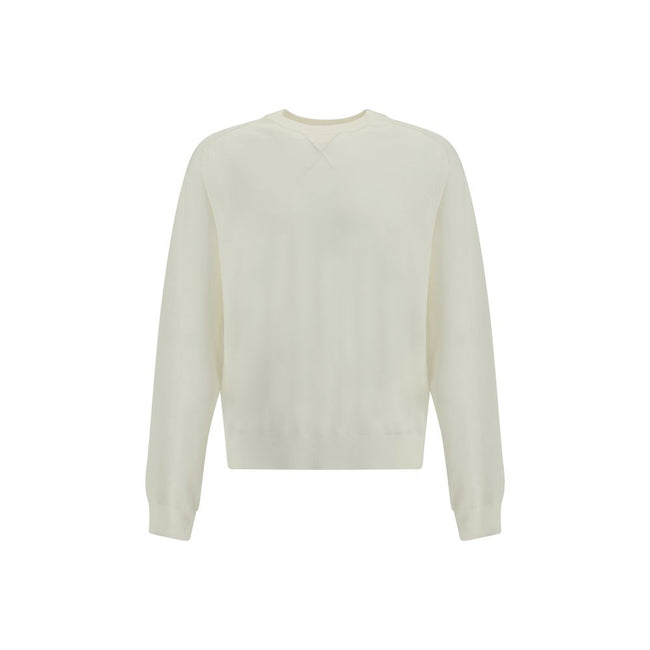 Crew-neck Sweater in merino woolThe crew-neck Sweater by Jacquemus, crafted from off-white merino wool, reflects effortless elegance. Overlock stitching beneath the neckline introduces a contemporary touch, while ribbed edges subtly define the relaxed sil