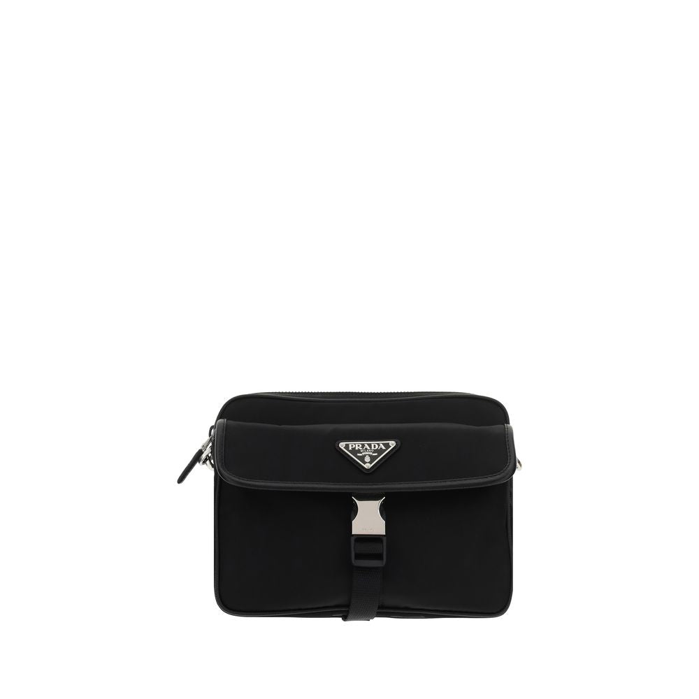 Black Polyamide Shoulder BagNylon Shoulder Bag by Prada, adjustable and removable shoulder strap with embroidered brand signature, removable mini pouch with zipper, triangular brand monogram plaque applied embossed on pouch, front push lock closure, iconi