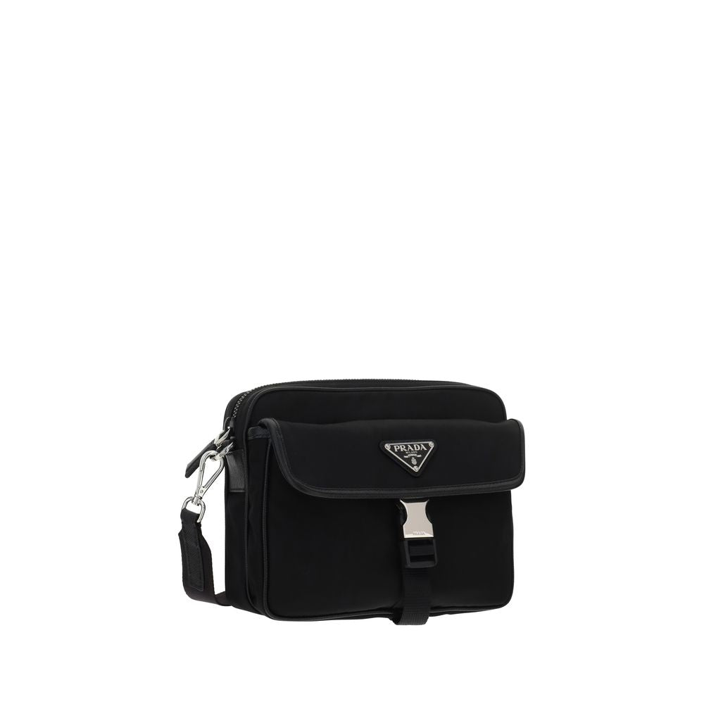 Black Polyamide Shoulder BagNylon Shoulder Bag by Prada, adjustable and removable shoulder strap with embroidered brand signature, removable mini pouch with zipper, triangular brand monogram plaque applied embossed on pouch, front push lock closure, iconi