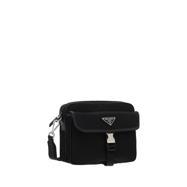 Black Polyamide Shoulder BagNylon Shoulder Bag by Prada, adjustable and removable shoulder strap with embroidered brand signature, removable mini pouch with zipper, triangular brand monogram plaque applied embossed on pouch, front push lock closure, iconi