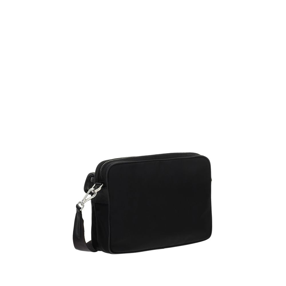 Black Polyamide Shoulder BagNylon Shoulder Bag by Prada, adjustable and removable shoulder strap with embroidered brand signature, removable mini pouch with zipper, triangular brand monogram plaque applied embossed on pouch, front push lock closure, iconi