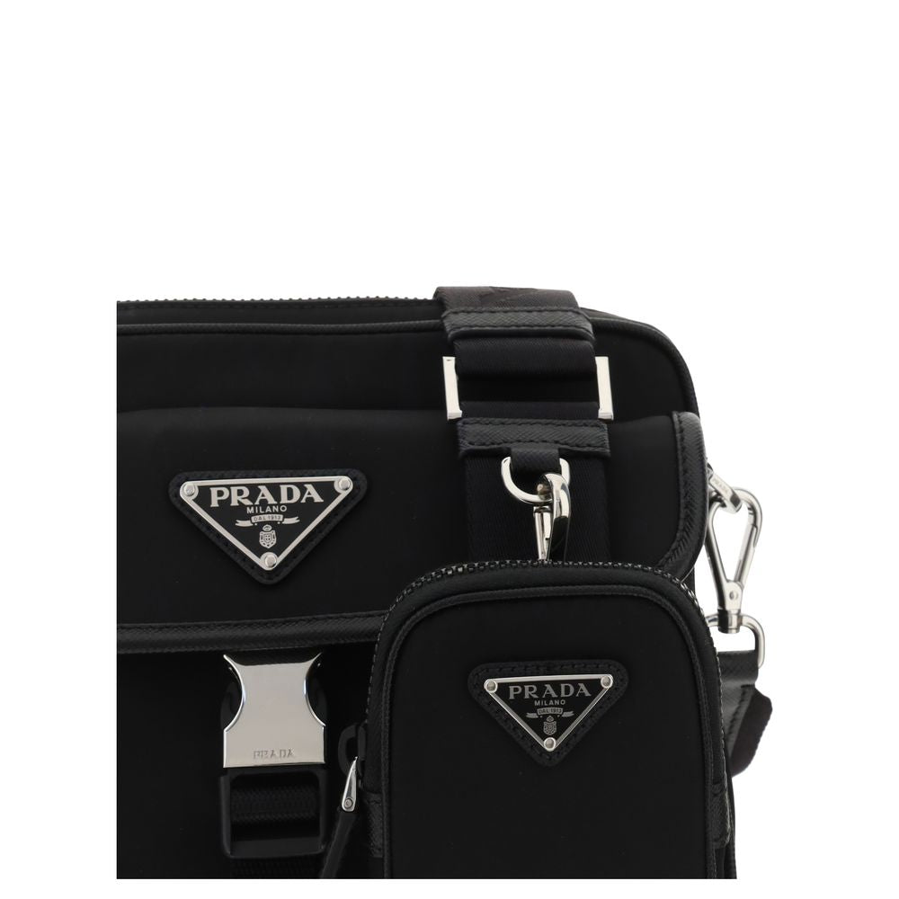 Black Polyamide Shoulder BagNylon Shoulder Bag by Prada, adjustable and removable shoulder strap with embroidered brand signature, removable mini pouch with zipper, triangular brand monogram plaque applied embossed on pouch, front push lock closure, iconi