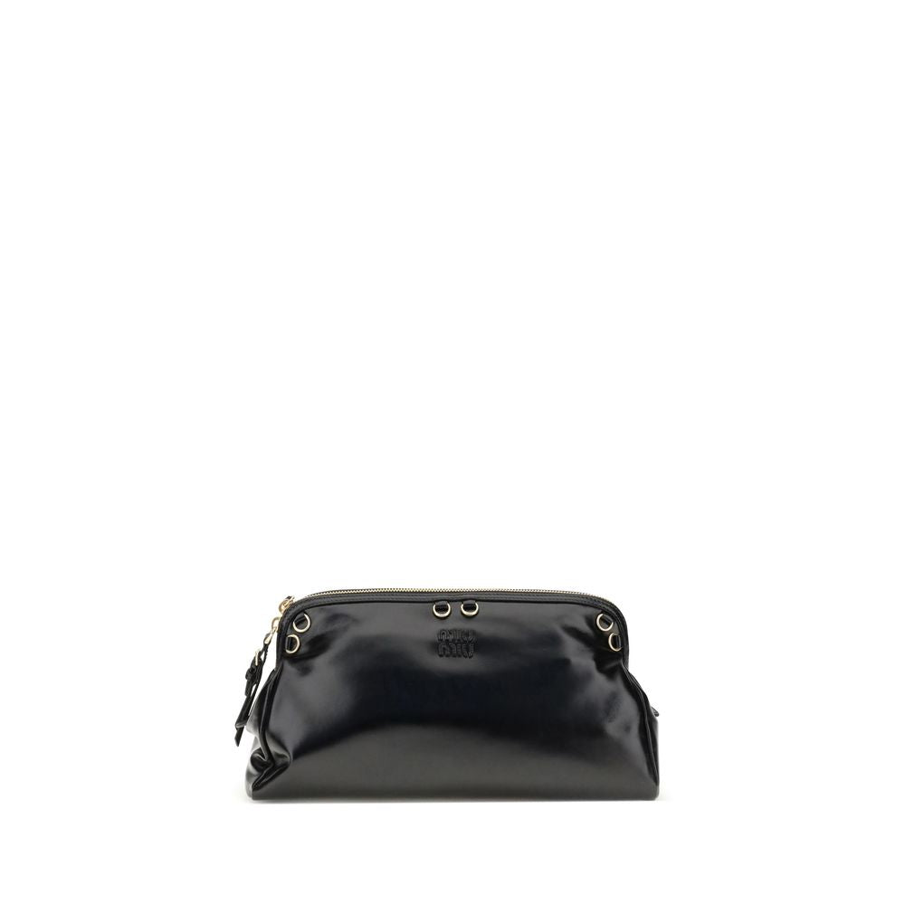 Black Calf Leather Bos Taurus Shoulder BagThe Softy Shoulder Bag by Miu Miu combines functionality and contemporary style. Featuring a double zip closure on the top, it has two adjustable and removable handles for versatile carrying. Decorative eyelets ad
