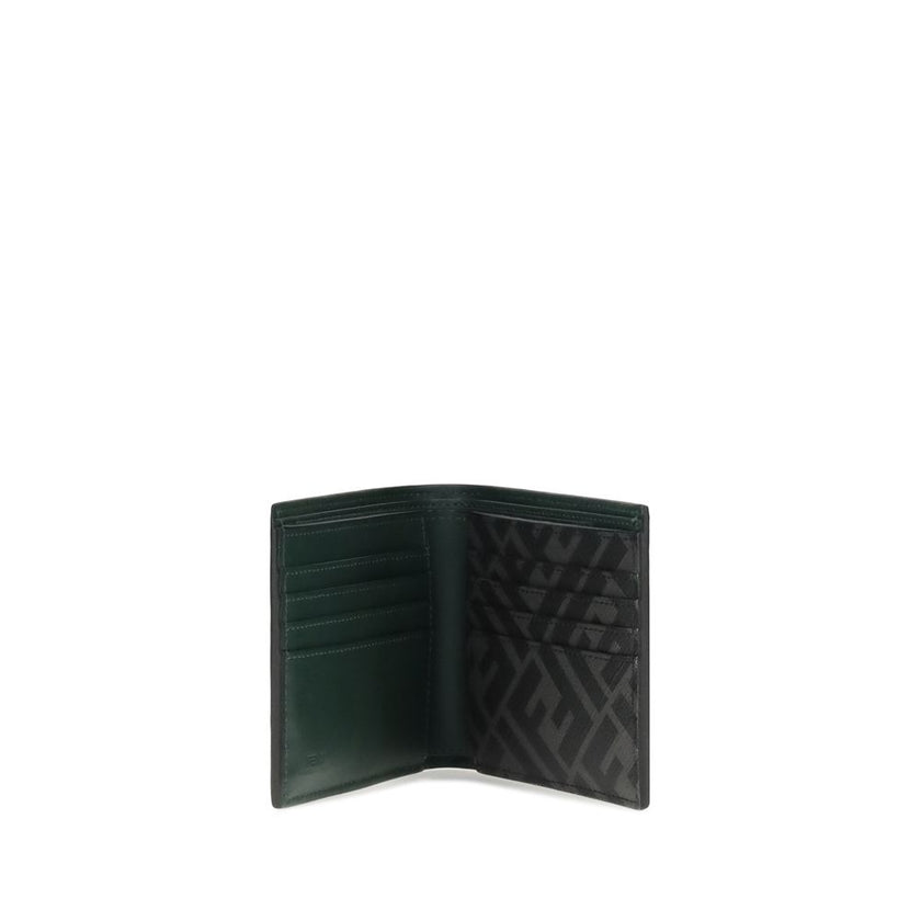 Black Calf Leather Bos Taurus WalletLeather Wallet by Fendi with an elegant and functional design, featuring the classic bifold model. The front is decorated with the three-dimensional plaque of the iconic FF logo, while the back features the contrasting
