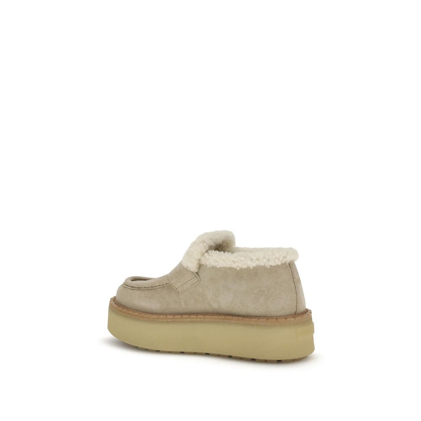 Beige Calf Leather Bos Taurus Platform LoafersSuede Loafers by Prada combine comfort and style in a bold design. Featuring a platform sole and round toe, they feature a soft shearling-lined interior for a snug fit. The upper tray is embellished with the i