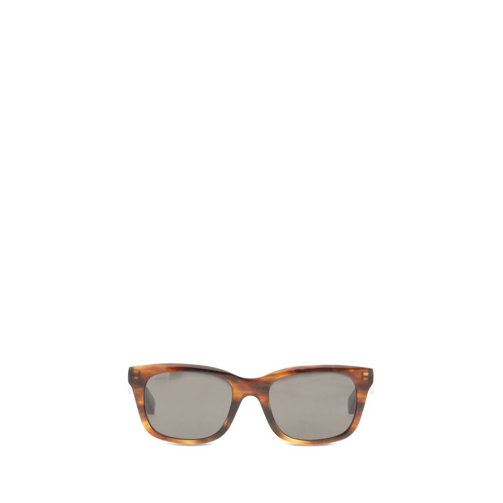 Brown Acetate SunglassesSunglasses by Balenciaga are made of acetate and feature a square, modern and distinctive shape. On the side is the brand’s signature, a detail that emphasizes its exclusivity. The lenses are made of Bio-Nylon, an innovative materi