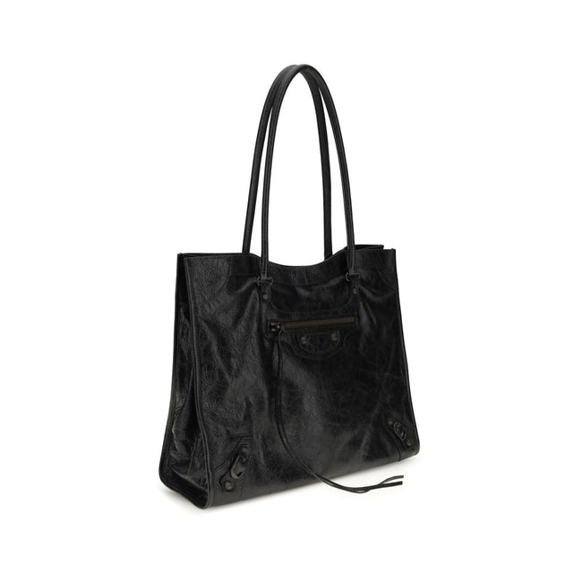 Black Lamb Ovis Aries Aries Shoulder BagThe Le City Tote Bag by Balenciaga is crafted from soft Arena lambskin leather with a vintage finish, offering a spacious and structured silhouette. Designed with two top handles (drop: 23.8 cm), it’s ideal for shou