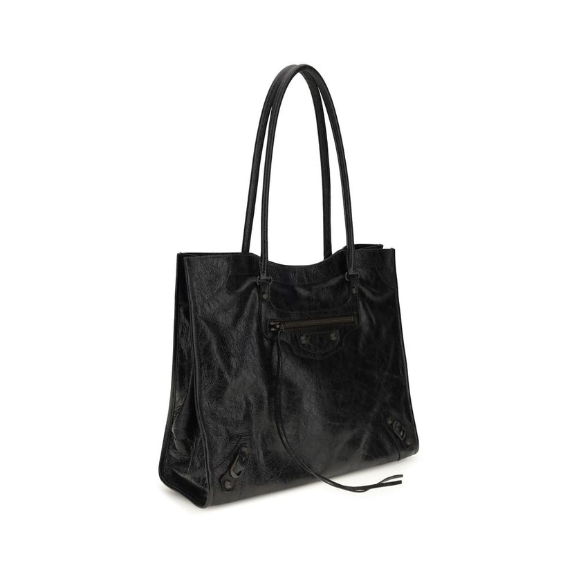 Black Lamb Ovis Aries Aries Shoulder BagThe Le City Tote Bag by Balenciaga is crafted from soft Arena lambskin leather with a vintage finish, offering a spacious and structured silhouette. Designed with two top handles (drop: 23.8 cm), it’s ideal for shou