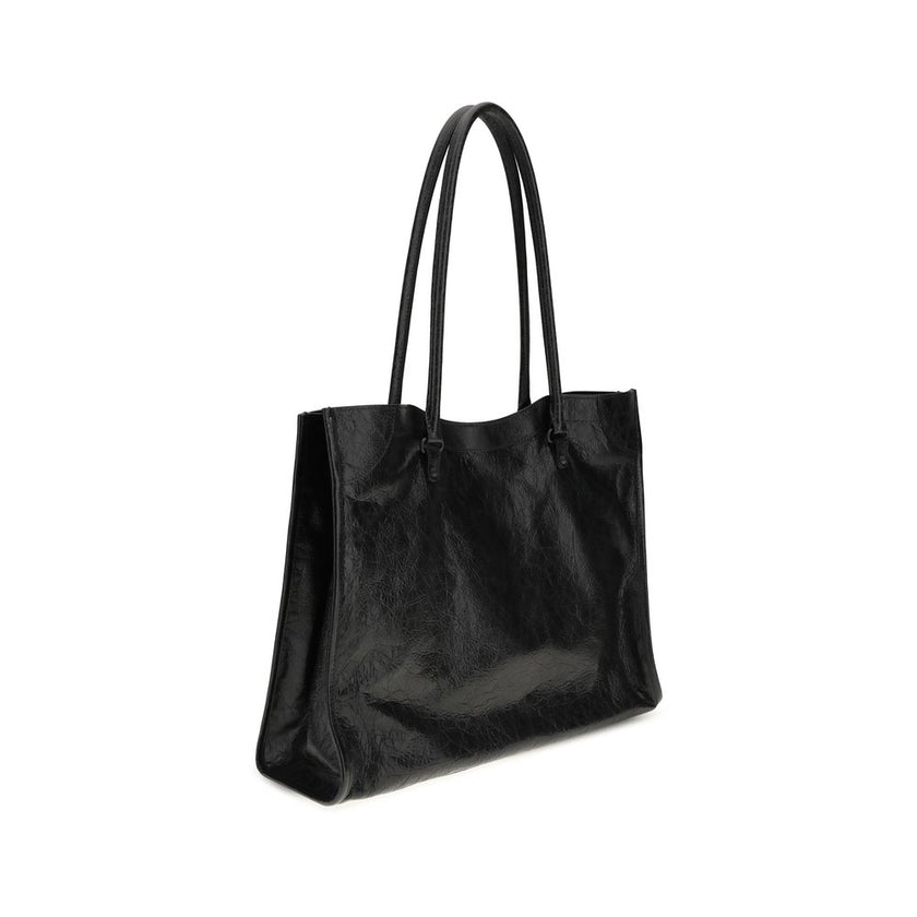 Black Lamb Ovis Aries Aries Shoulder BagThe Le City Tote Bag by Balenciaga is crafted from soft Arena lambskin leather with a vintage finish, offering a spacious and structured silhouette. Designed with two top handles (drop: 23.8 cm), it’s ideal for shou