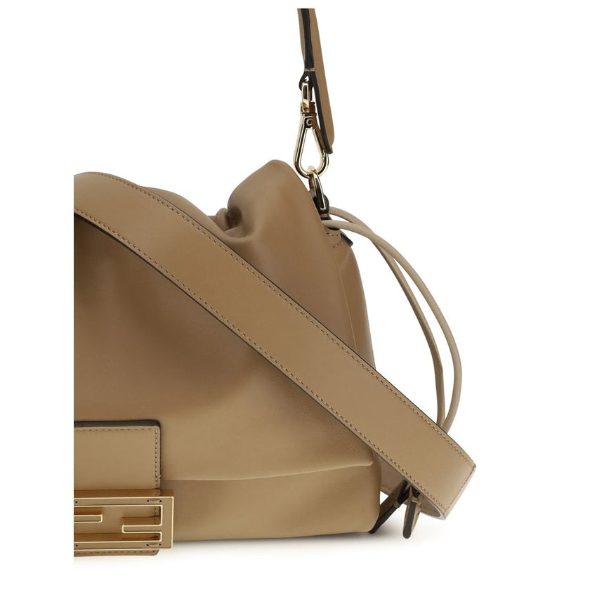 Mamma Baguette Shoulder BagMamma Baguette Shoulder Bag by Fendi is a style icon reimagined with contemporary elegance. Crafted with a decorative FF closure and tone-on-tone leather insert, it features a large suede-lined interior compartment enhanced by a