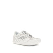 Hamptons Worn-out SneakersHamptons Worn-out Sneakers by Balenciaga reinterpret streetwear style with a medium-worn effect that lends character and originality. Twisted laces, exposed topstitching and raw-cut edges enhance the intentionally lived-in aesthe