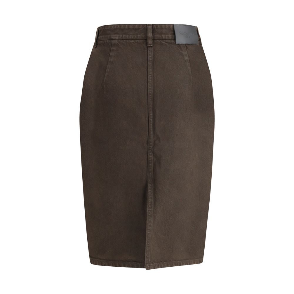 Brown Denim SkirtThe Denim Pencil Skirt by Saint Laurent combines practicality with contemporary style in an essential piece. Crafted from certified cotton, it features a mid-rise waist with belt loops, a back vent for ease of movement, and a fitted silho