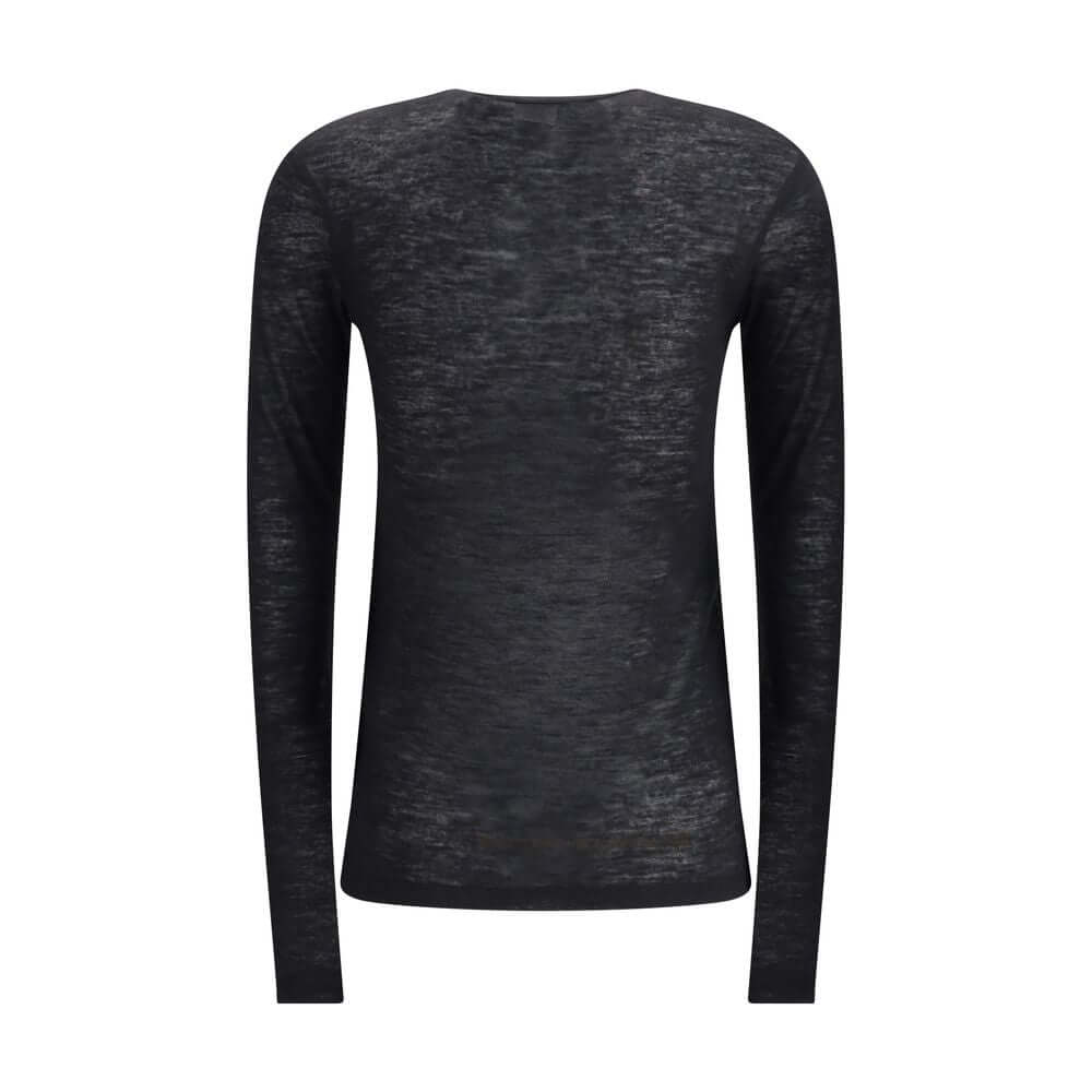Black Cashmere Long Sleeve T-ShirtThe short-sleeved T-shirt in Cashmere and Silk by Saint Laurent is an essential piece that expresses refinement through simplicity. Featuring a classic crew neck and clean lines, it embraces the silhouette with the lightn