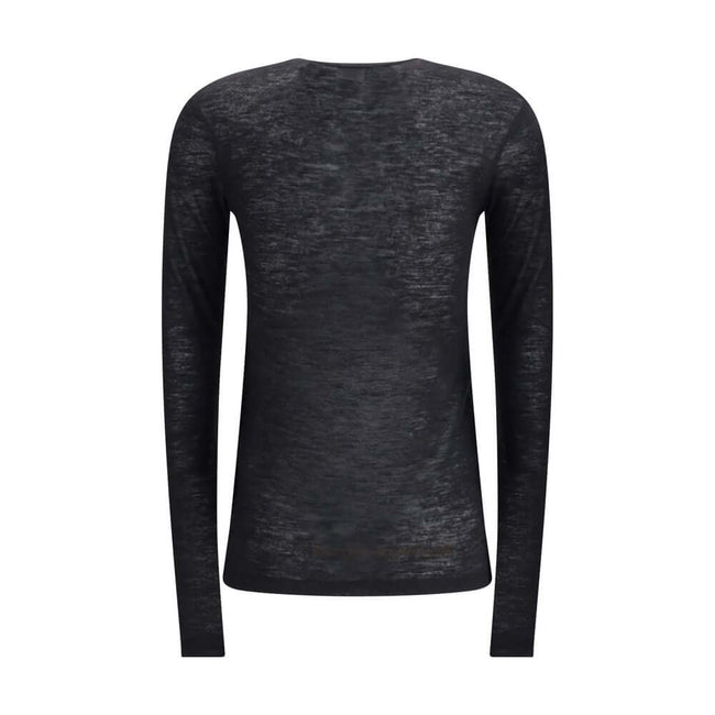 Black Cashmere Long Sleeve T-ShirtThe short-sleeved T-shirt in Cashmere and Silk by Saint Laurent is an essential piece that expresses refinement through simplicity. Featuring a classic crew neck and clean lines, it embraces the silhouette with the lightn