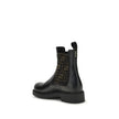 FF leather and fabric Ankle BootsFF leather and fabric Ankle Boots by Fendi combine urban style with iconic details. Made of black leather with elastic side inserts, they feature fabric details with the unmistakable FF motif. The back is embellished with