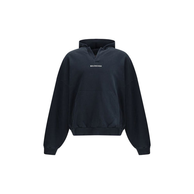 Black Cotton SweatshirtThe Hoodie by Balenciaga blends comfort with iconic design. Crafted from medium fleece, it features a relaxed silhouette with dropped shoulders and a functional kangaroo pocket. Elasticated cuffs and hem ensure a defined fit, while