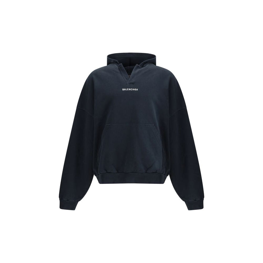 Black Cotton SweatshirtThe Hoodie by Balenciaga blends comfort with iconic design. Crafted from medium fleece, it features a relaxed silhouette with dropped shoulders and a functional kangaroo pocket. Elasticated cuffs and hem ensure a defined fit, while