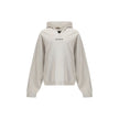 White Cotton SweatshirtThe Hoodie by Balenciaga blends comfort with iconic design. Crafted from medium fleece, it features a relaxed silhouette with dropped shoulders and a functional kangaroo pocket. Elasticated cuffs and hem ensure a defined fit, while