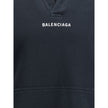 Black Cotton SweatshirtThe Hoodie by Balenciaga blends comfort with iconic design. Crafted from medium fleece, it features a relaxed silhouette with dropped shoulders and a functional kangaroo pocket. Elasticated cuffs and hem ensure a defined fit, while