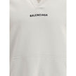 White Cotton SweatshirtThe Hoodie by Balenciaga blends comfort with iconic design. Crafted from medium fleece, it features a relaxed silhouette with dropped shoulders and a functional kangaroo pocket. Elasticated cuffs and hem ensure a defined fit, while