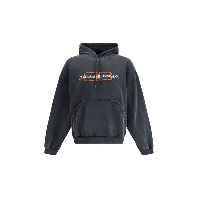 Black Cotton SweatshirtThe Balenciaga hooded Sweatshirt brings a luxury twist to a streetwear essential. Crafted from soft cotton, it features a kangaroo pocket at the front and ribbed cuffs and hem for a structured finish. The logo graphic across the che