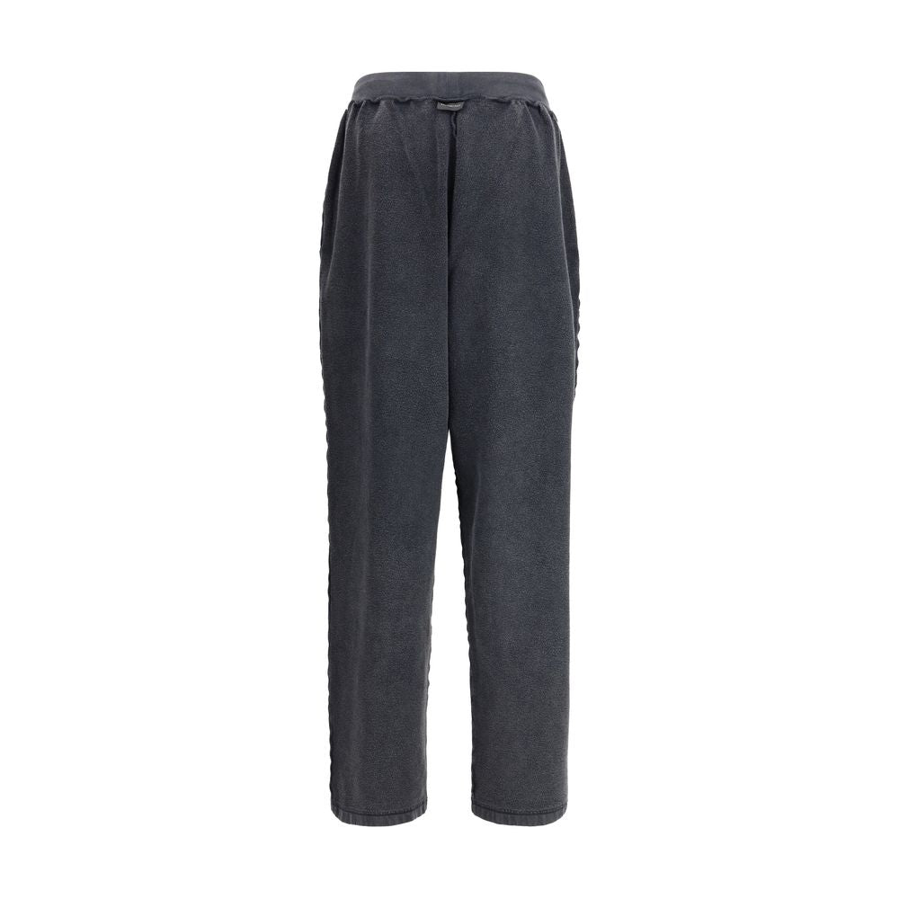 Black Cotton Joggers (Workout Pants)The Oversized Sweatpants by Balenciaga redefine the classic sportswear staple with a bold, contemporary twist. Crafted in washed-effect cotton, they feature exposed seams that create an inside-out illusion—an iconic det