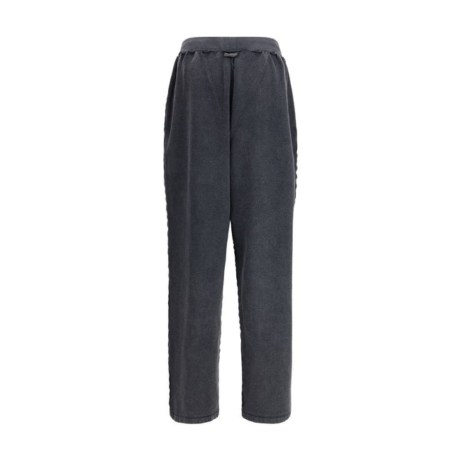 Black Cotton Joggers (Workout Pants)The Oversized Sweatpants by Balenciaga redefine the classic sportswear staple with a bold, contemporary twist. Crafted in washed-effect cotton, they feature exposed seams that create an inside-out illusion—an iconic det