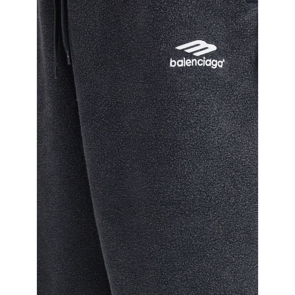 Black Cotton Joggers (Workout Pants)The Oversized Sweatpants by Balenciaga redefine the classic sportswear staple with a bold, contemporary twist. Crafted in washed-effect cotton, they feature exposed seams that create an inside-out illusion—an iconic det