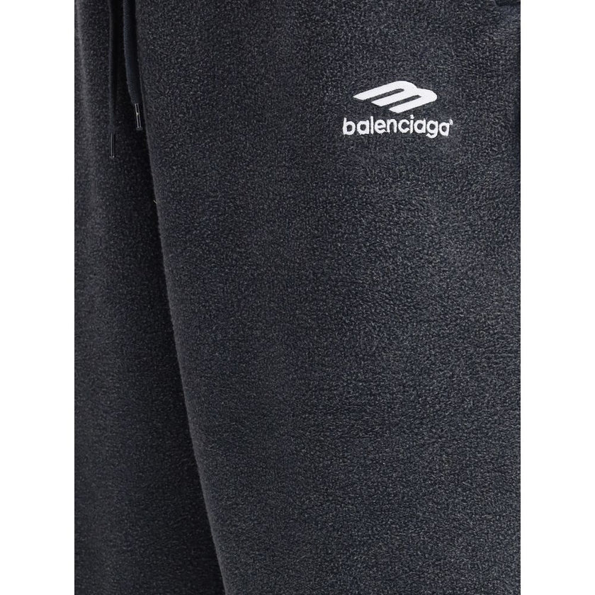 Black Cotton Joggers (Workout Pants)The Oversized Sweatpants by Balenciaga redefine the classic sportswear staple with a bold, contemporary twist. Crafted in washed-effect cotton, they feature exposed seams that create an inside-out illusion—an iconic det