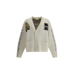 Cream Cotton CardiganThe Moon Vars Knit Cardigan by Off-White reflects the brand’s urban-inspired aesthetic with a wool construction and relaxed fit. Intarsia patterns and embroidered details bring together signature codes with the seasonal moon motif at