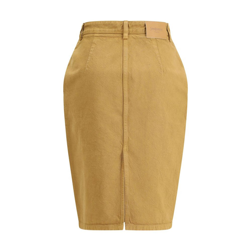 Beige Denim SkirtThe Denim Pencil Skirt by Saint Laurent combines practicality with contemporary style in an essential piece. Crafted from certified cotton, it features a mid-rise waist with belt loops, a back vent for ease of movement, and a fitted silho