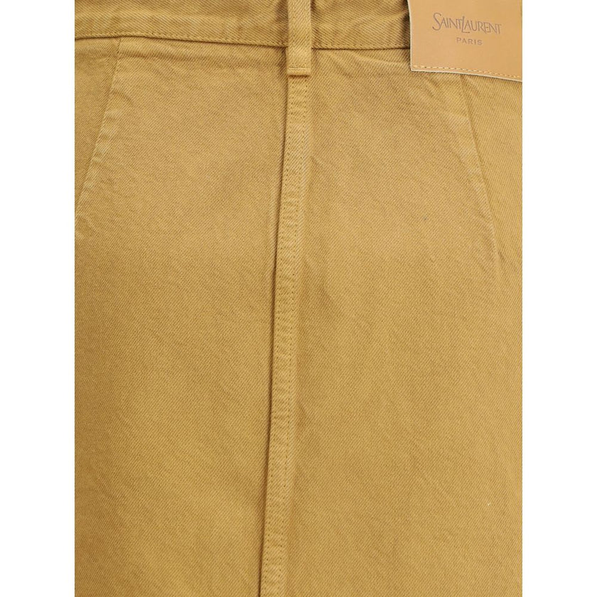Beige Denim SkirtThe Denim Pencil Skirt by Saint Laurent combines practicality with contemporary style in an essential piece. Crafted from certified cotton, it features a mid-rise waist with belt loops, a back vent for ease of movement, and a fitted silho