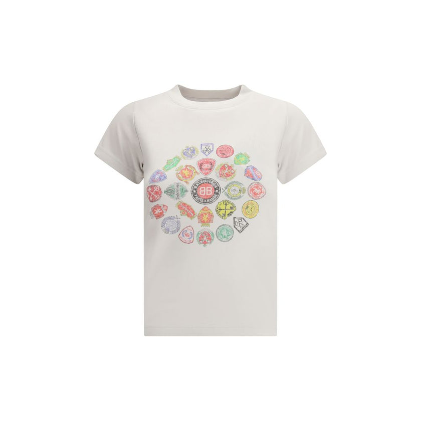 White Cotton T-ShirtThe Graphic Logo Crew Neck T-Shirt by Balenciaga embodies the minimalist and contemporary essence of the Maison. Crafted from soft cotton, it features short sleeves and a crew neckline that define its clean, versatile silhouette. The g