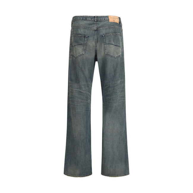 Blue Cotton Relaxed Fit JeansThe relaxed fit Cotton denim Pants feature a washed, worn-out effect that brings a laid-back yet refined appeal. Designed with a mid-rise waist, concealed zip fly, and Balenciaga-engraved button, they offer five pockets and fi