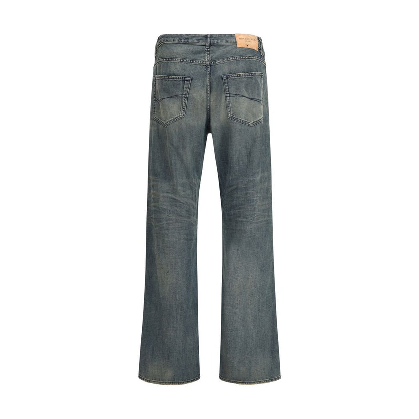 Blue Cotton Relaxed Fit JeansThe relaxed fit Cotton denim Pants feature a washed, worn-out effect that brings a laid-back yet refined appeal. Designed with a mid-rise waist, concealed zip fly, and Balenciaga-engraved button, they offer five pockets and fi