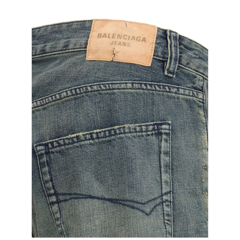 Blue Cotton Relaxed Fit JeansThe relaxed fit Cotton denim Pants feature a washed, worn-out effect that brings a laid-back yet refined appeal. Designed with a mid-rise waist, concealed zip fly, and Balenciaga-engraved button, they offer five pockets and fi