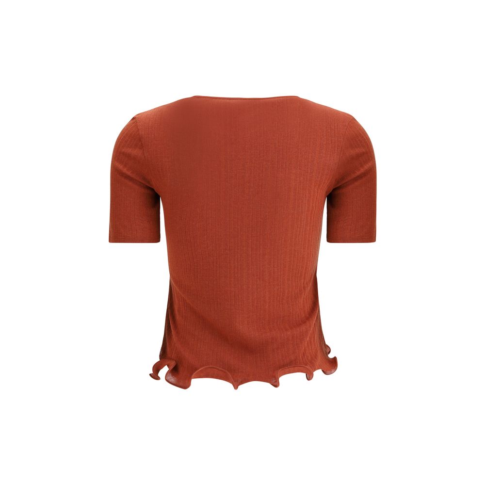Red Fleece Wool TopThe short-sleeved Virgin Wool Top by Fendi is an essential piece that combines refined simplicity with iconic details. Made from ribbed Virgin Wool, it features a fitted cut with a classic crewneck, enhancing the silhouette with minimal
