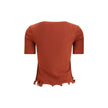 Red Fleece Wool TopThe short-sleeved Virgin Wool Top by Fendi is an essential piece that combines refined simplicity with iconic details. Made from ribbed Virgin Wool, it features a fitted cut with a classic crewneck, enhancing the silhouette with minimal