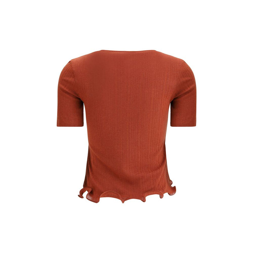 Red Fleece Wool TopThe short-sleeved Virgin Wool Top by Fendi is an essential piece that combines refined simplicity with iconic details. Made from ribbed Virgin Wool, it features a fitted cut with a classic crewneck, enhancing the silhouette with minimal