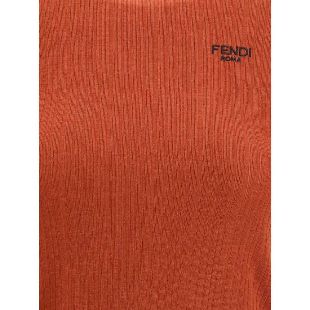 Red Fleece Wool TopThe short-sleeved Virgin Wool Top by Fendi is an essential piece that combines refined simplicity with iconic details. Made from ribbed Virgin Wool, it features a fitted cut with a classic crewneck, enhancing the silhouette with minimal