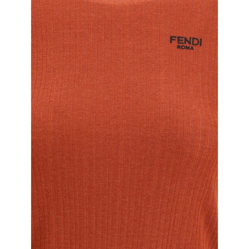 Red Fleece Wool TopThe short-sleeved Virgin Wool Top by Fendi is an essential piece that combines refined simplicity with iconic details. Made from ribbed Virgin Wool, it features a fitted cut with a classic crewneck, enhancing the silhouette with minimal