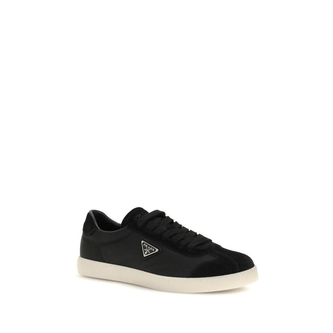 Black Leather Low Top SneakersLeather Sneakers by Prada combine contemporary style with everyday comfort. Featuring a flat rubber sole and round toe, they are distinguished by the iconic triangular side-applied plaque and tone-on-tone logo on the back, ad