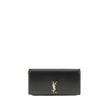 Black Calf Leather Bos Taurus Shoulder BagThe Cassandre Smartphone Case by Saint Laurent is a stylish and functional accessory, featuring a front flap decorated with the iconic YSL initials in gold metal. Equipped with a leather and chain shoulder strap,