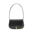 Black Calf Leather Bos Taurus Shoulder BagThe Voltaire mini Shoulder Bag by Saint Laurent is an elegant crescent-shaped bag crafted from calfskin with a lightly polished finish. Bronze-colored metallic parts add a warm, vintage touch, while the Cassandre
