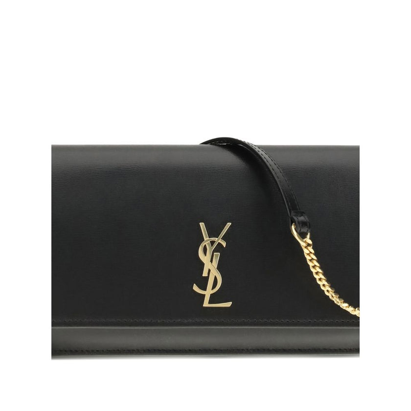 Black Calf Leather Bos Taurus Shoulder BagThe Cassandre Smartphone Case by Saint Laurent is a stylish and functional accessory, featuring a front flap decorated with the iconic YSL initials in gold metal. Equipped with a leather and chain shoulder strap,