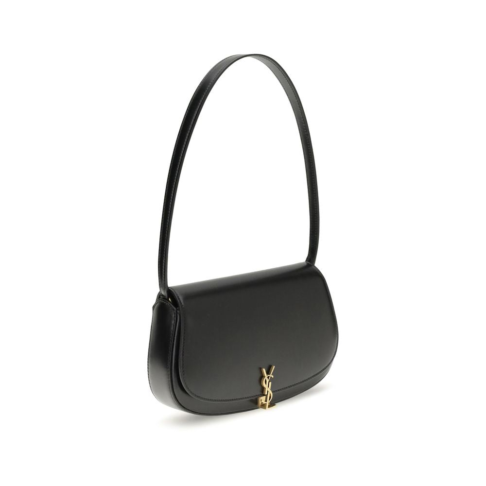 Black Calf Leather Bos Taurus Shoulder BagThe Voltaire mini Shoulder Bag by Saint Laurent is an elegant crescent-shaped bag crafted from calfskin with a lightly polished finish. Bronze-colored metallic parts add a warm, vintage touch, while the Cassandre