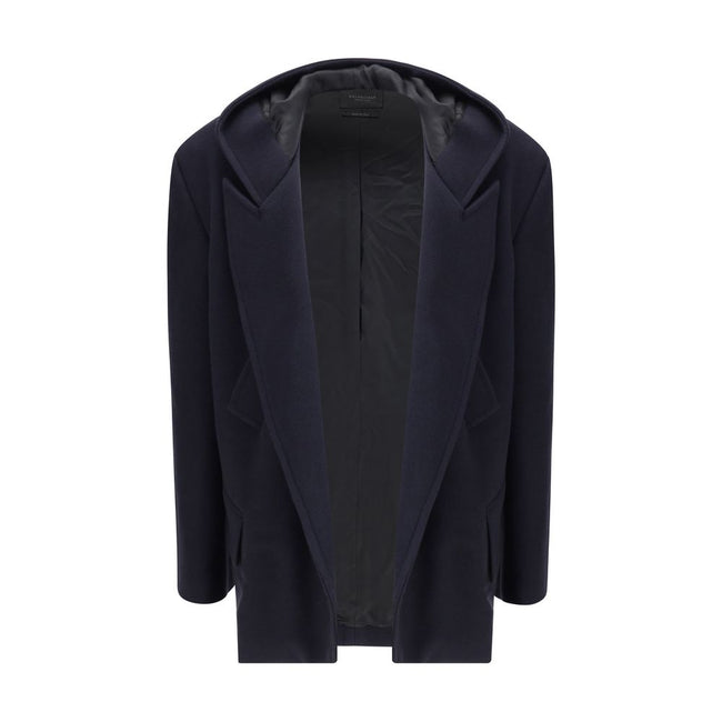 Hooded Short CoatThe hooded short Coat by Balenciaga blends tailored refinement with the brand’s contemporary edge. Crafted from dark navy brushed wool, it features a structured cut enhanced by shoulder pads and peak lapels, giving the silhouette a bold p